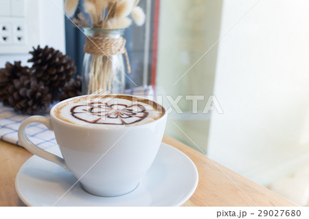 hot coffee with foam milk art in afternoon break 29027680