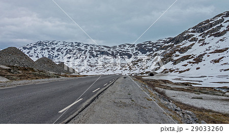 Road #63 with snowy mountain to Geiranger fjord. Road #63 with snowy mountain to Geiranger fjord. 29033260