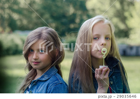 Portrait of two little girls enjoying summers. 29035646