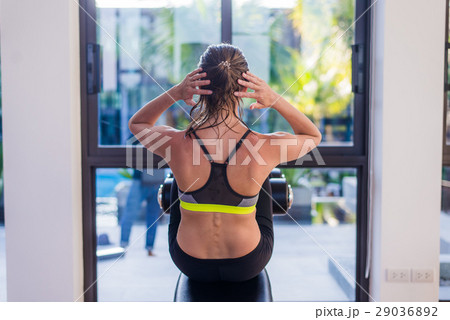 Attractive fit woman working out abs in fitness Attractive fit woman working out abs in fitness 29036892