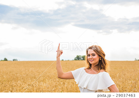 Happy travel woman smile to you and show something 29037463