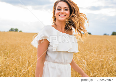 Beauty Girl Outdoors enjoying nature on the Field Beauty Girl Outdoors enjoying nature on the Field 29037467