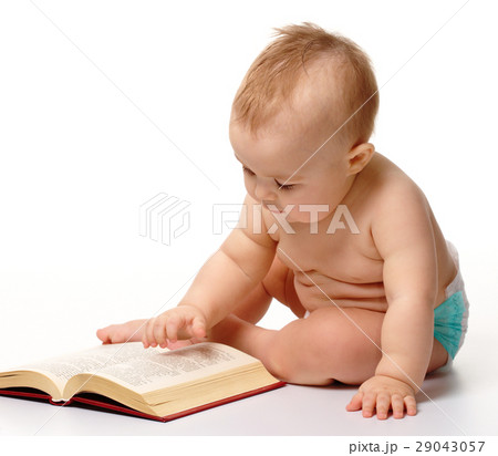 Little child play with book 29043057