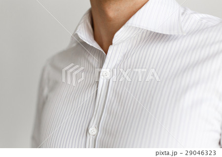 White shirt on the businessman. Unbuttoned collar. 29046323