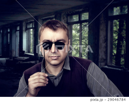 Young male with funny sunglasses on a stick Young male with funny sunglasses on a stick 29046784