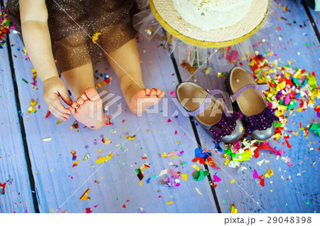 kid barefooted legs in against the confetti and kid barefooted legs in against the confetti and 29048398