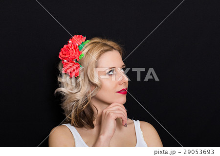 Woman with blonde laying and rimmed  red flowers 29053693