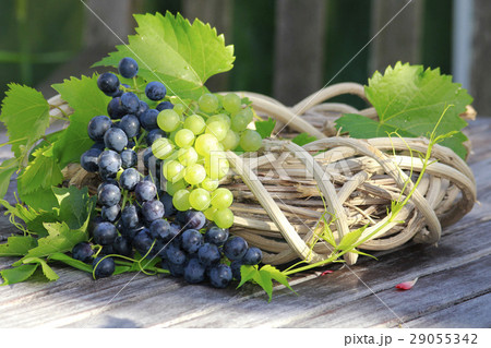 Red grapes on a wooden table 29055342