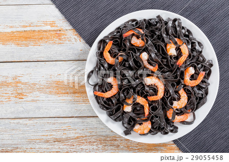 delicious Cuttlefish ink pasta with prawns 29055458