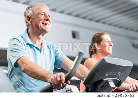 senior man and young woman spinning  29055763