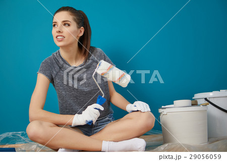 bright picture of lovely housewife painting at home 29056059