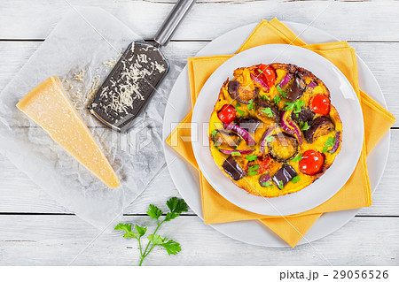 frittata on white dish with table napkin 29056526