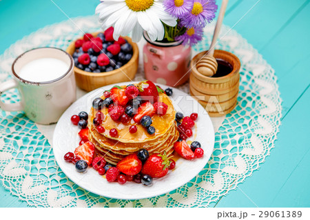 Stack of pancakes on wooden background Stack of pancakes on wooden background 29061389