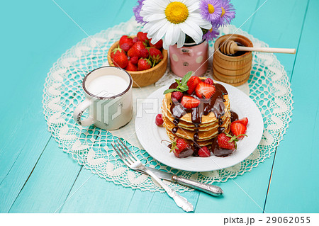 Stack of pancakes on wooden background Stack of pancakes on wooden background 29062055