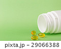Fish oil pills and a bottle of medicine 29066388