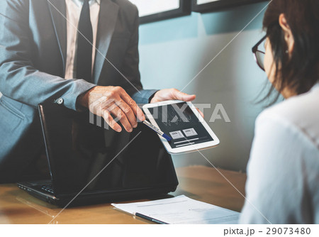 Businessman complain to Businesswoman  29073480