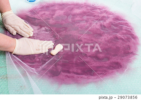 hatter soaps the wool fibers on layout through net 29073856