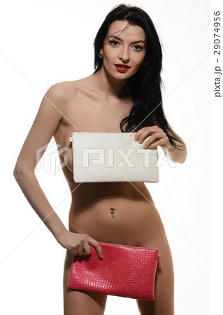young girl  holding red and white leather handbag 29074956