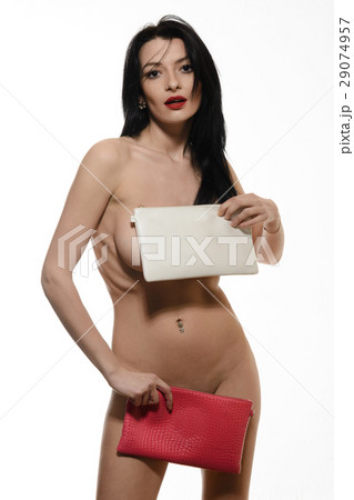 Fashion studio photo of elegant woman with clutch Fashion studio photo of elegant woman with clutch 29074957