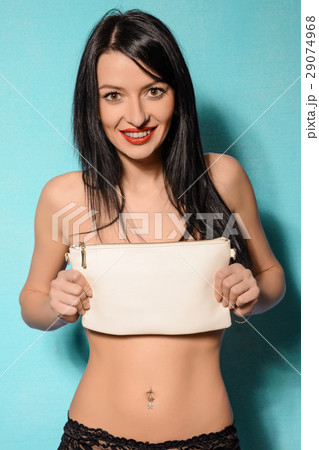 Fashion studio photo of elegant woman with clutch Fashion studio photo of elegant woman with clutch 29074968