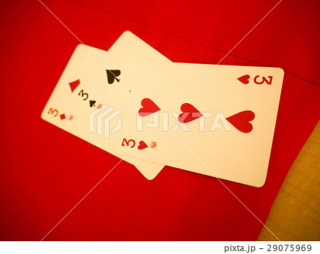 Playing cards on red table Playing cards on red table 29075969