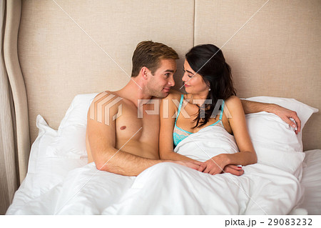 Young couple in white bed. 29083232