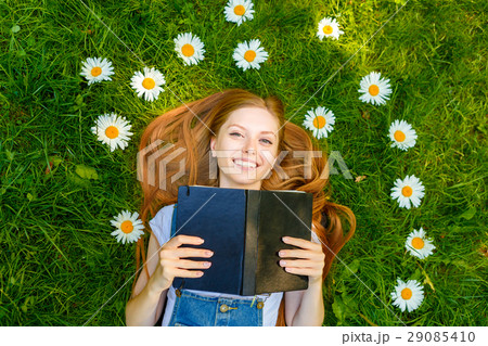 Beautiful smiling red-haired young woman Beautiful smiling red-haired young woman 29085410