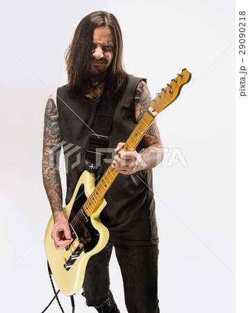Guitarist plays guitar. 29090218
