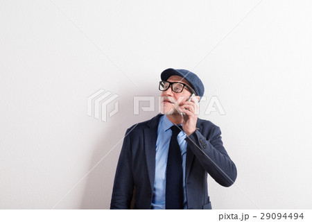 Senior man in blue shirt, jacket, eyeglasses and 29094494
