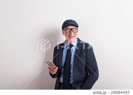 Senior man in blue shirt, jacket, eyeglasses and 29094497