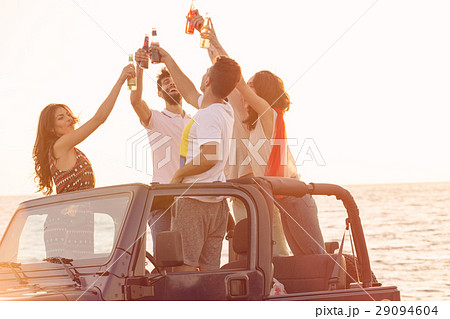 Five young people having fun in convertible car at Five young people having fun in convertible car at 29094604
