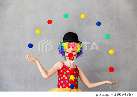 Funny kid clown playing indoor Funny kid clown playing indoor 29094867