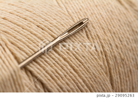 sewing needle on thread 29095263