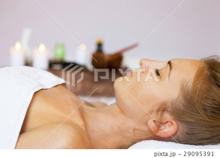 Portrait of a young woman getting spa treatment 29095391
