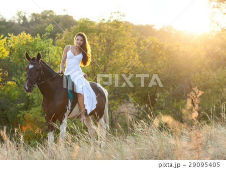 Beautiful woman and a horse Beautiful woman and a horse 29095405