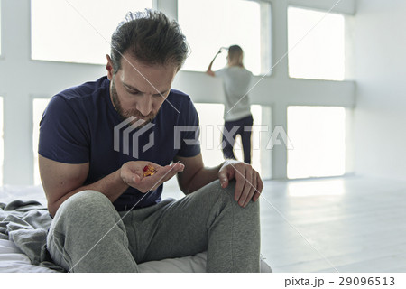 Despaired male holding different tablets Despaired male holding different tablets 29096513