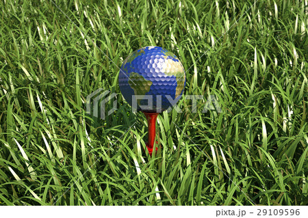 Golf ball on tee in the grass, with earth planet map. 29109596