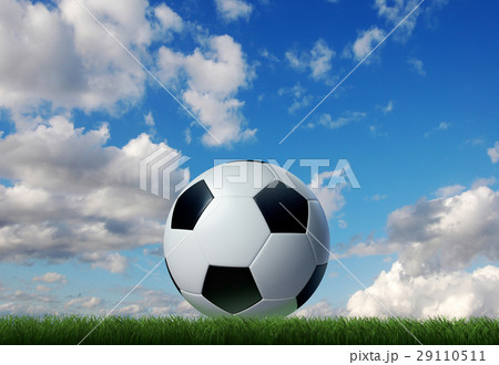Football/soccer classic ball, on grass, with sky on the background. Football/soccer classic ball, on grass, with sky on the background. 29110511