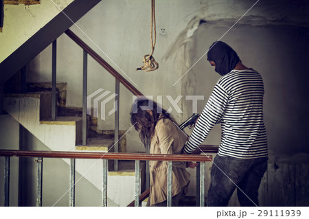 woman kidnapped by criminals. 29111939