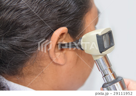 Doctor Examining Patient's Ear With Otoscope 29111952