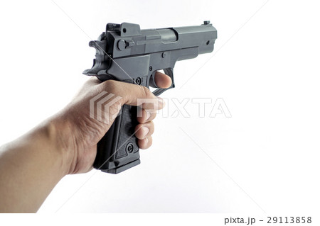 hand holding a handgun hand holding a handgun 29113858
