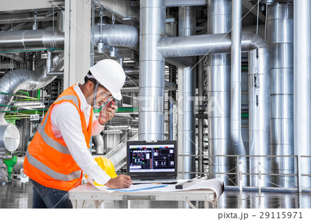 Engineer using computer for maintenance in factory Engineer using computer for maintenance in factory 29115971