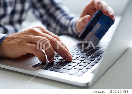 Man inserts data for online payments Man inserts data for online payments 29119453