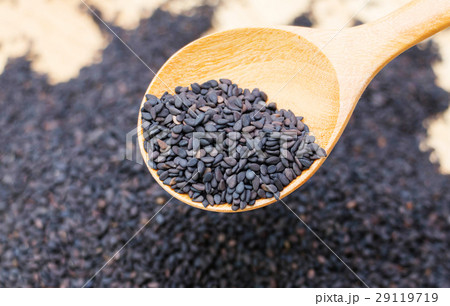 spoon of black sesame seeds spoon of black sesame seeds 29119719