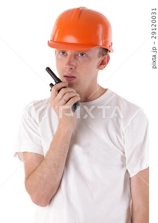 worker talking on portable UHF radio transceiver worker talking on portable UHF radio transceiver 29120031