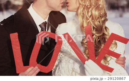 couple kissing on wedding day with letters word 29120867