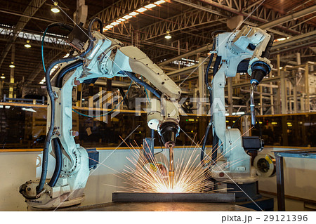 Team robot are welding steel part in factory Team robot are welding steel part in factory 29121396