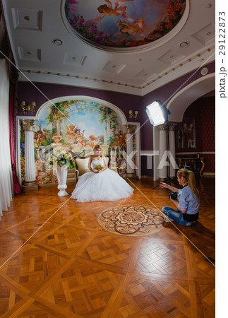 Photographer is taking pictures the bride  29122873