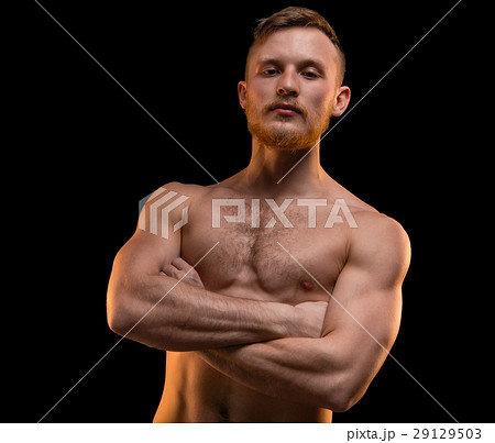 Muscular man with arms crossed Muscular man with arms crossed 29129503