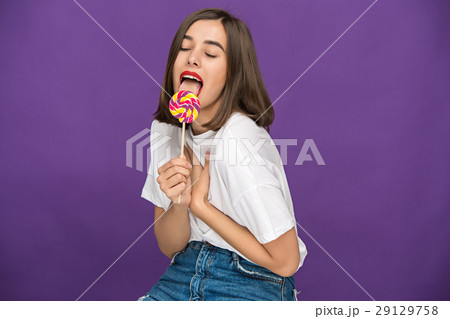 The young woman with colorful lollipop The young woman with colorful lollipop 29129758